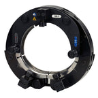 Black metal ring component with various features on a white background