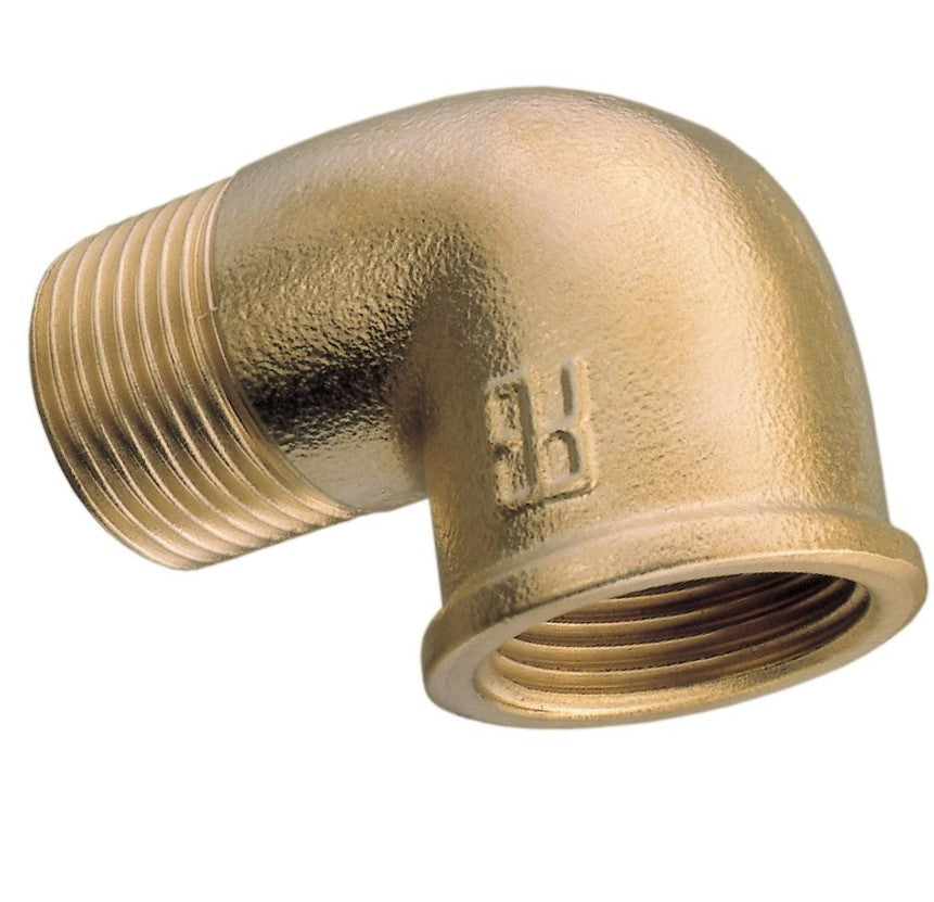Brass elbow pipe fitting on a white background