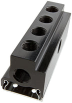 Black metal block with multiple threaded holes on a white background